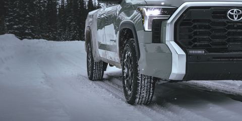 A Toyota Tundra driving in the snow
